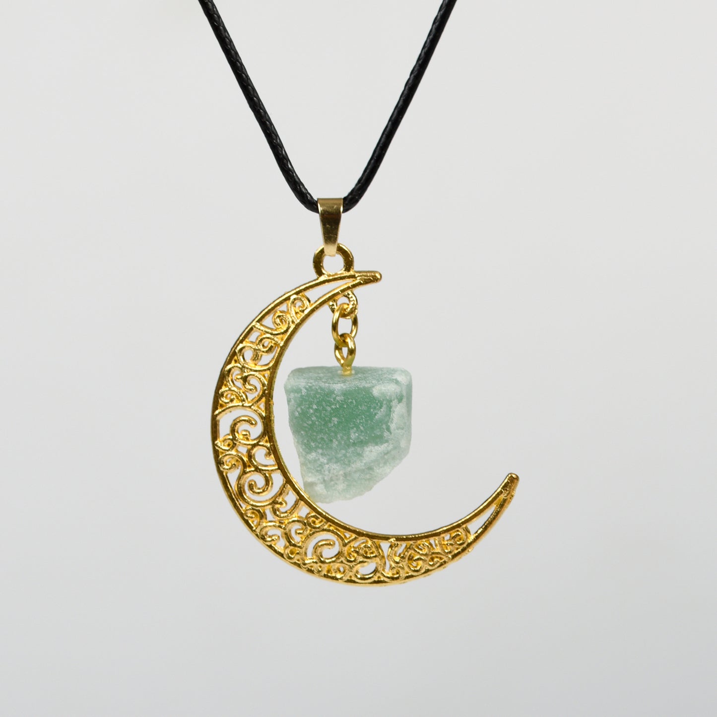 Raw crystal with moon pendant