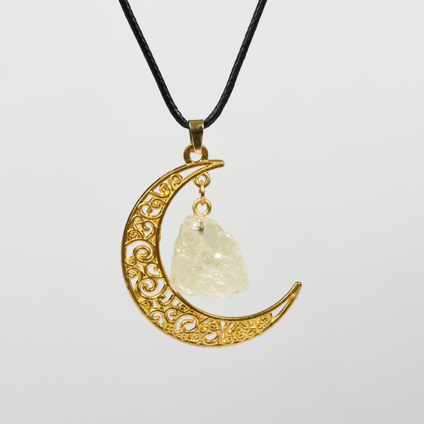 Raw crystal with moon pendant